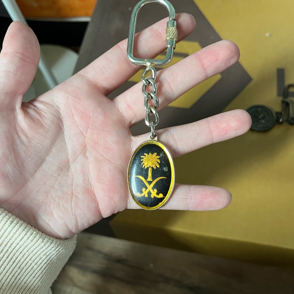 Black and Gold Keychain with Palm Tree Design